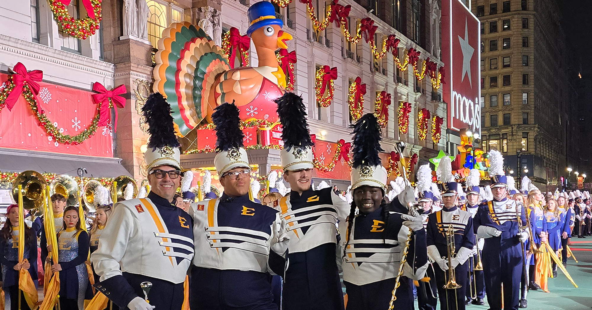 ETSU's drum majors pose in Herald Square in front of Macy's