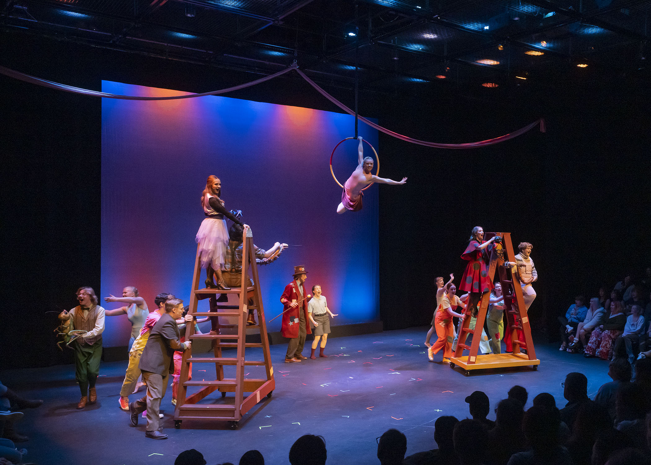 ETSU aerial dance students fly through the air as part of a performance of James and the Giant Peach