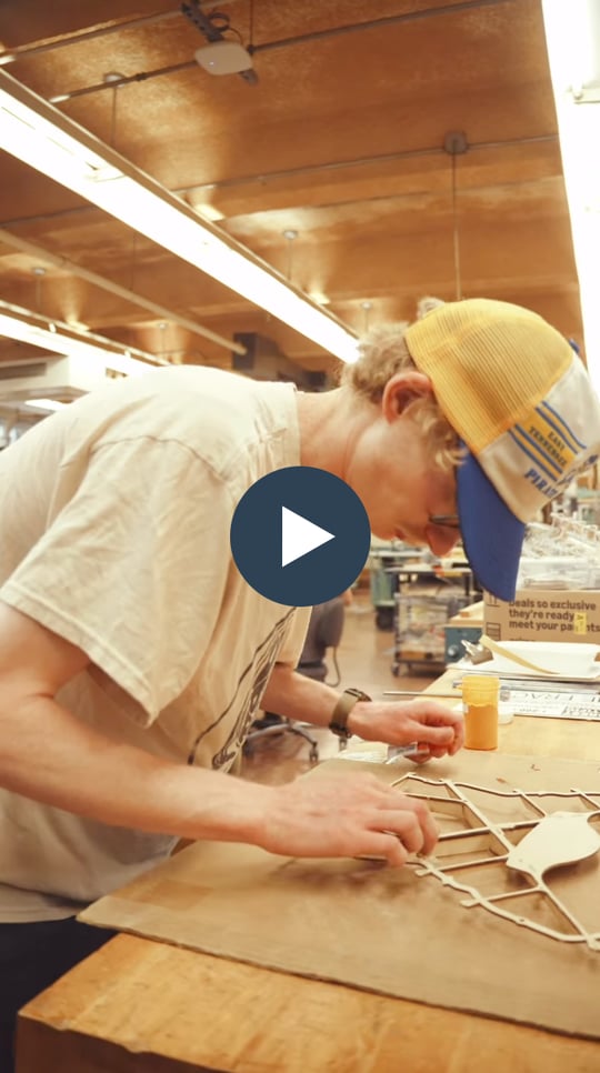 A student building a guitar