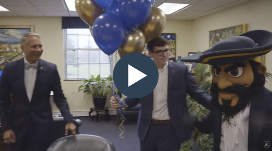 A screenshot of a video featuring Trent White, Bucky, and President Noland
