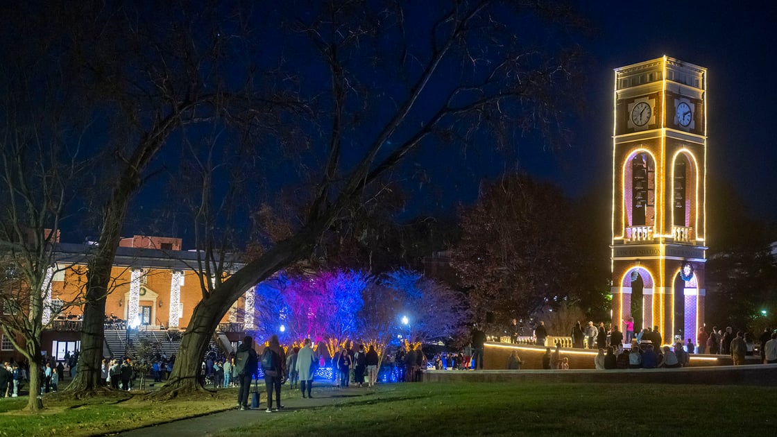 The ETSU carillon outlined with blue and gold holiday lights