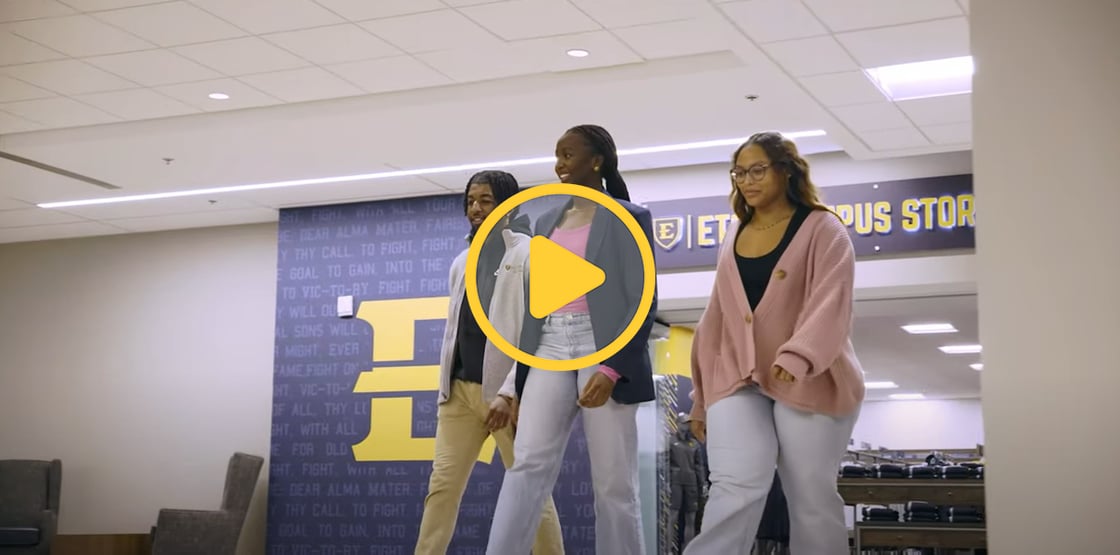 A photo of three people walking through the Culp with the ETSU Campus Store in the background.