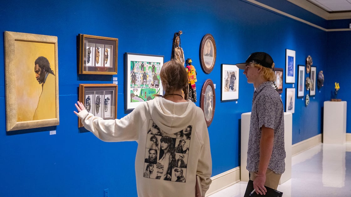 Students examine a gallery of work in ETSU's Reece Museum
